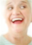 Senior woman smiling, close-up, portrait, blurred