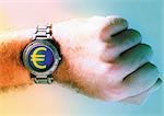 Euro sign on man's wrist watch.
