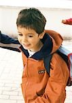 Child carrying backpack
