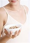 Woman holding bowl of potpourri