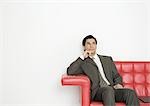 Businessman sitting on couch