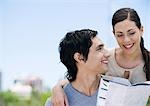 Young couple looking at map together