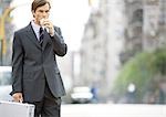 Businessman in the street, eating on the go