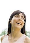 Woman smiling and looking up, portrait