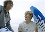 Young men with surfboard