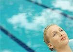 Woman relaxing near pool