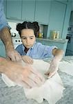 Father and daughter making pie crust