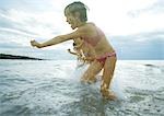 Children playing in surf