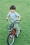 Boy on bike, full length