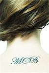 Initials tattooed on teenage girl's back