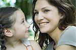 Girl smiling at mother, close-up