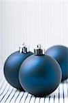 Three blue Christmas tree ornaments