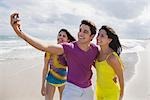 Friends Taking a Picture of Themselves on the Beach