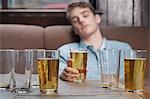 Young man asleep in bar