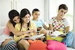 Young female friends doing homework together