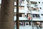 Apartment building with laundry hanging in front of windows