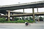 Overpasses, motorbike in foreground, blurred motion