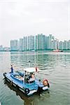 Garbage boat cleaning river