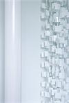 White plastic curtain and column, cropped view
