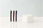 Pens and note block, close-up