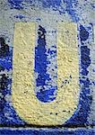 U, text, painted.