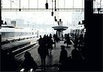 People in silhoutte on crowded train platform