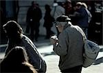 People dressed for cold weather, walking outdoors, rear view