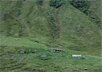 Log cabins on mountainside