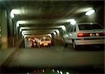 Cars inside a tunnel, blurry.