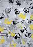 Yellow, black, gray hand print on wall