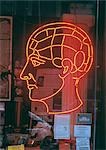 Neon head sign on store window