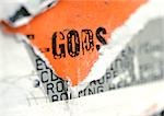 Gods text printed on torn poster, close-up