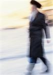 Israel, Jerusalem, Orthodox Jew walking, blurred