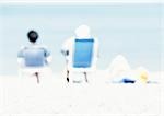 Couple sitting in chairs on the beach, rear view, blurred