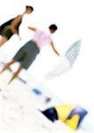 People on beach with parasol, blurred