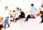 People sitting, superimposed on map, blurry.