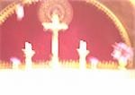 Israel, Jerusalem, cross and candles on altar in church, blurred