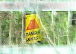 Danger mines! sign, montage