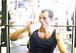 Man drinking water in gym