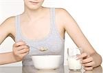 Young woman eating cereal