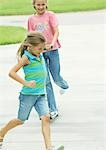 Suburban children playing in driveway