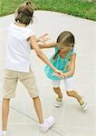 Girls playing hopscotch