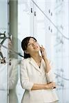 Young businesswoman using cell phone