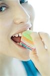 Woman eating candy, close-up of face