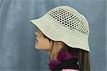 Teenage girl wearing sun hat, side view