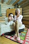 Two teen girls sitting by fireplace, wearing tights and slippers, looking  at camera, full length, Stock Photo, Picture And Royalty Free Image. Pic.  ALT-PAA454000001