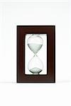 Hourglass in wooden frame