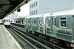 Commuters waiting for subway on elevated train platform, IRT Flushing Line of New York City Subway