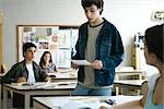 High school student giving presentation in class