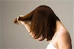 Woman combing hair